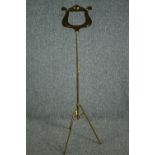 A modern folding brass music stand. H.130cm.