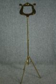 A modern folding brass music stand. H.130cm.