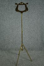 A modern folding brass music stand. H.130cm.