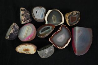 A collection of eleven agate geode pieces and slices, some dyed. L.10cm. (largest) Proceeds from