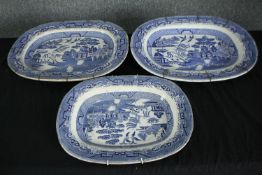 Three large blue and white Chinese willow pattern meat platters. H.38 W.47cm.