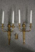 A pair of gilt metal Classical design brass twin branch wall sconces. H.66cm. (Each).