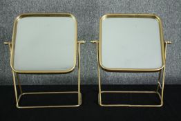 A pair of contemporary metal framed swing mirrors. H.46 W.39cm. (each)