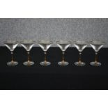 A set of six gilt rimmed martini glasses. H.15cm. (Each).