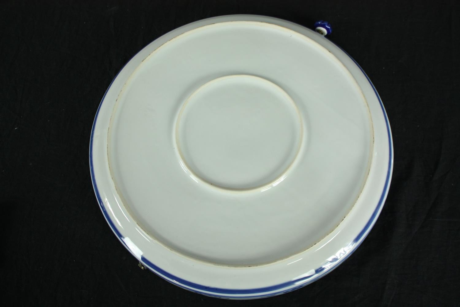 A 20th century blue and white elephant design plate. (has hole with handle attached). Dia.36cm. - Image 3 of 4