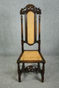 A Carolean style oak side chair with recently re-caned back and seat. H.122cm.