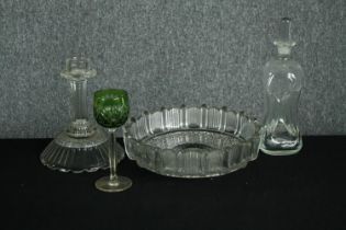 An assortment of early twentieth century glassware including a candlestick, decanter, and lime green