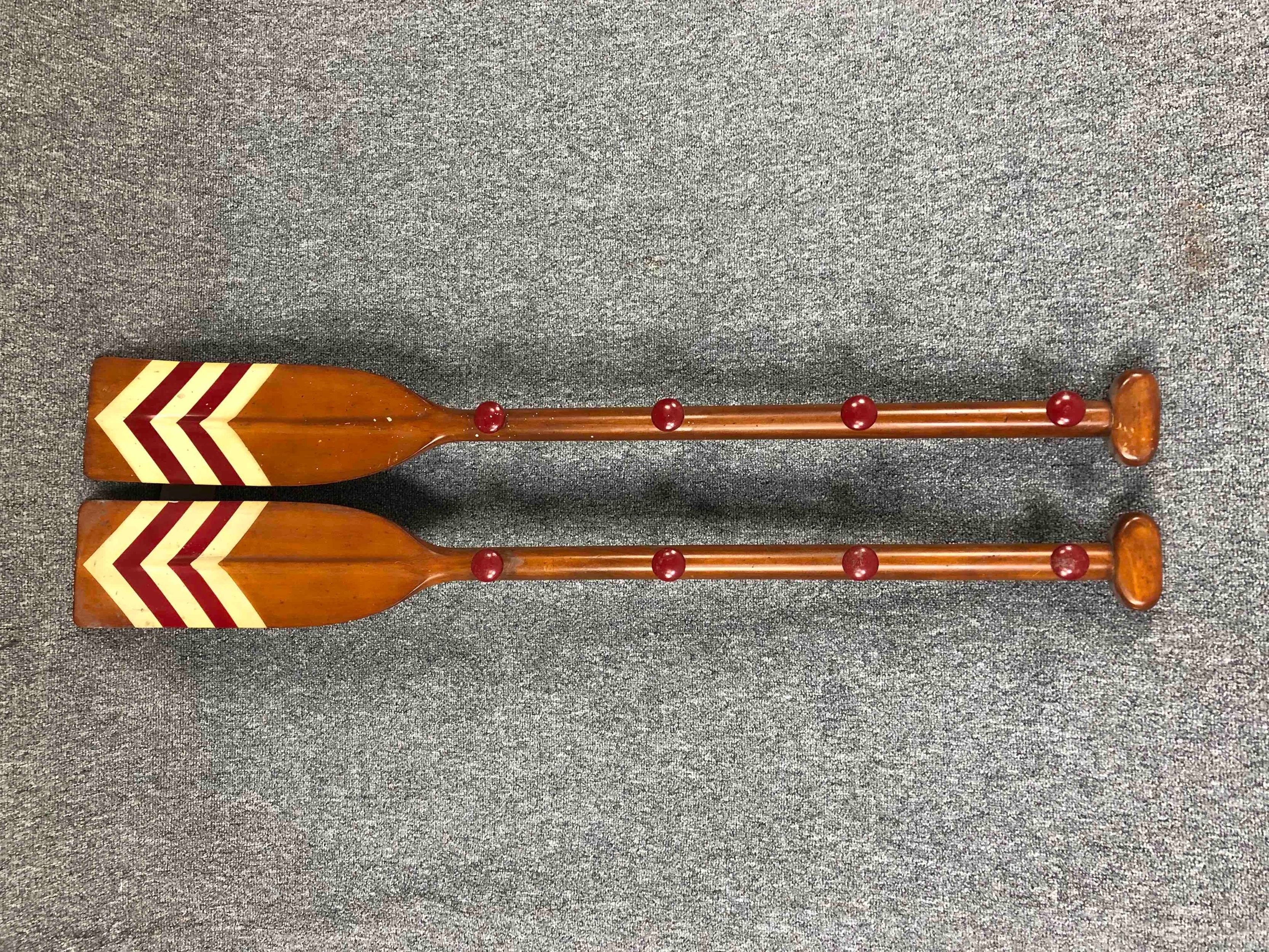 A pair of coats hooks mounted on reproduction wooden oars. L.120cm. (each)