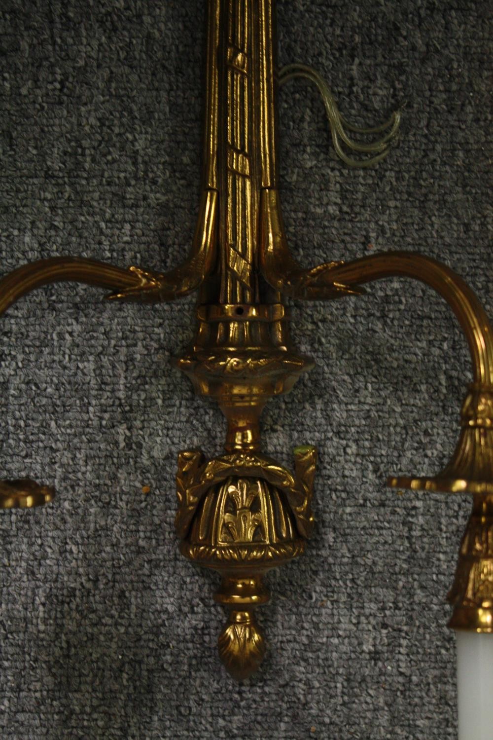 A pair of gilt metal Classical design brass twin branch wall sconces. H.66cm. (Each). - Image 5 of 8