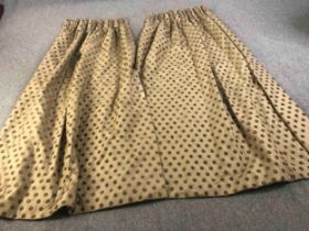 A pair of gold silk mix fully lined curtains with brown velvet spotted design. L.224 W.(top) 75 (