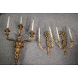 A carved gilt wood three sconce wall candelabra along with a similar twin branch pair. L.90cm. (