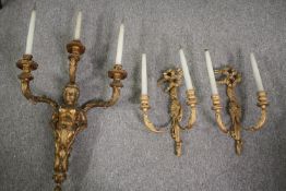 A carved gilt wood three sconce wall candelabra along with a similar twin branch pair. L.90cm. (