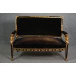 Canape, 19th century Empire style, ebonised and gilt. H.98 W.120 D.55cm.