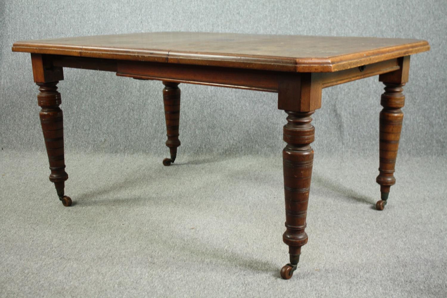 Dining table, Victorian walnut with fixed central leaf. H.74 W.148 D.104cm. - Image 3 of 4