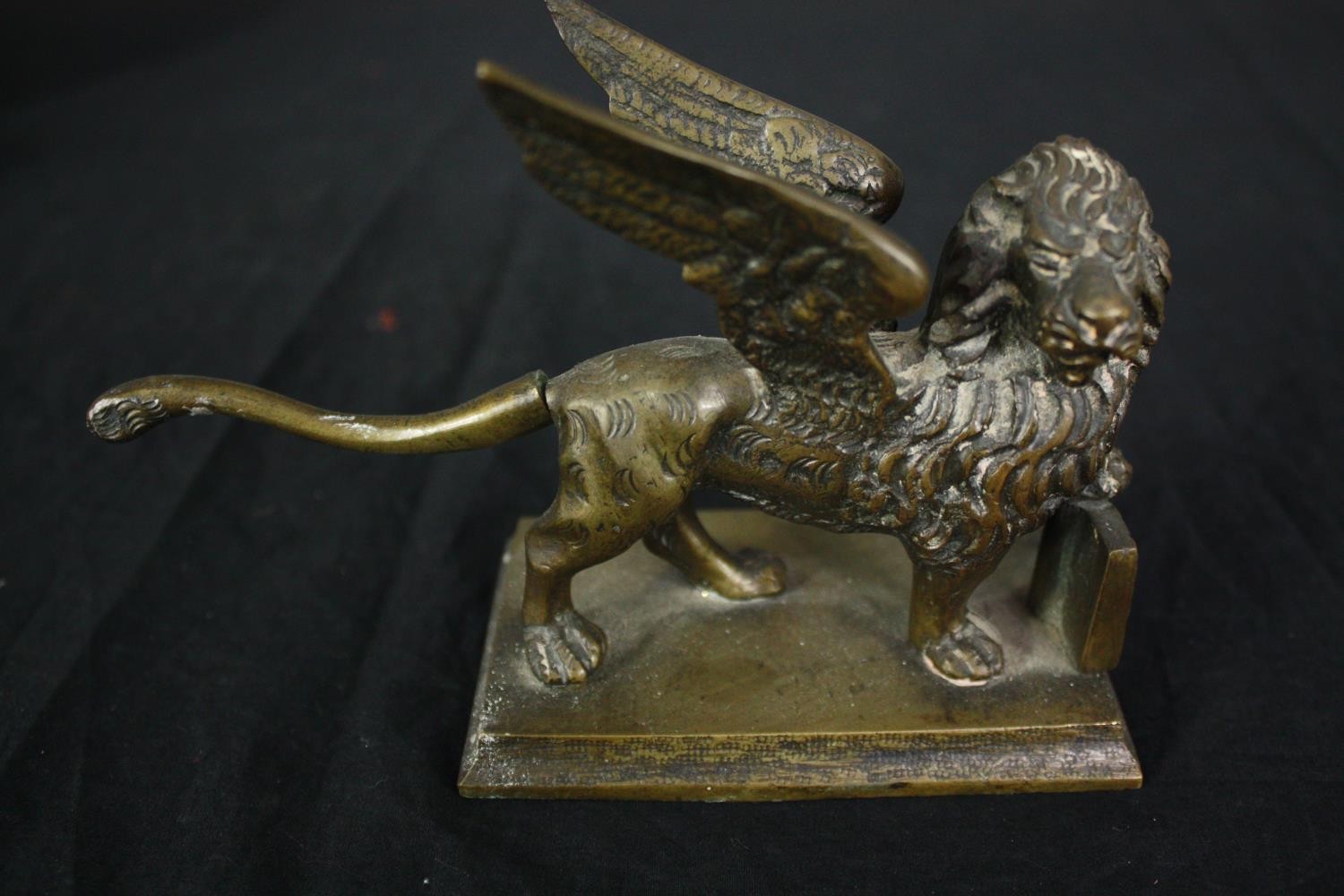 An Indian silver plated repousse mirror, a brass winged lion, a gilt bronze bowl stand and a pair of - Image 7 of 7