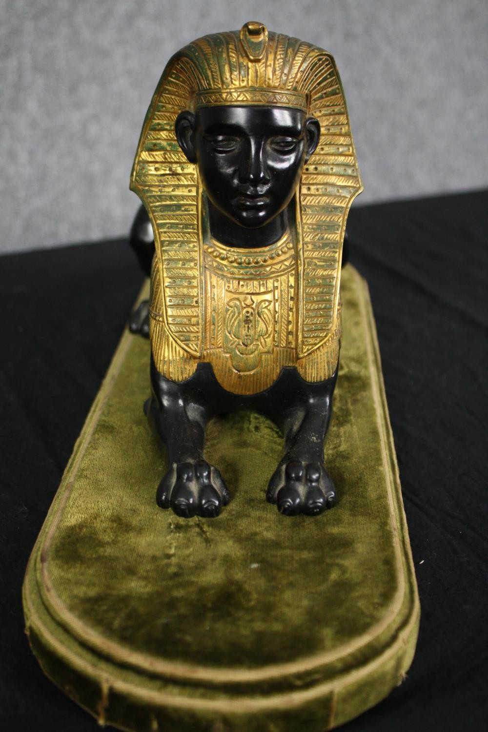 A Grand Tour Egyptian Revival spelter and gilt figure of a recumbent Sphinx. H.20 W.43 D.14cm. - Image 4 of 5
