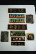 An assortment of Victorian Magic Lantern slides and portrait photographs. The slides include comical