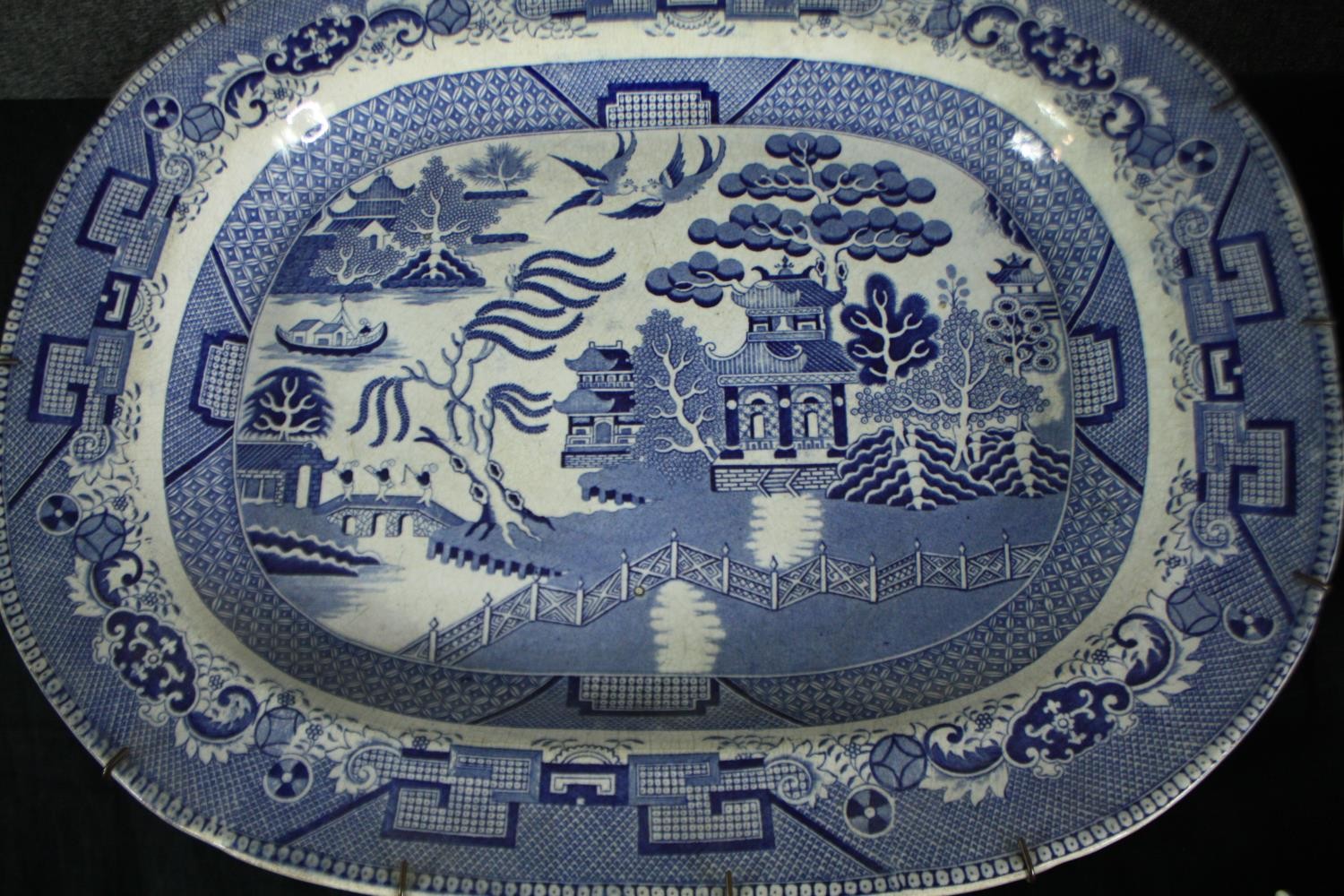 Three large blue and white Chinese willow pattern meat platters. H.38 W.47cm. - Image 3 of 5