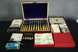 A collection of British Sheffield silver plate cutlery, a carving set, and name place settings in