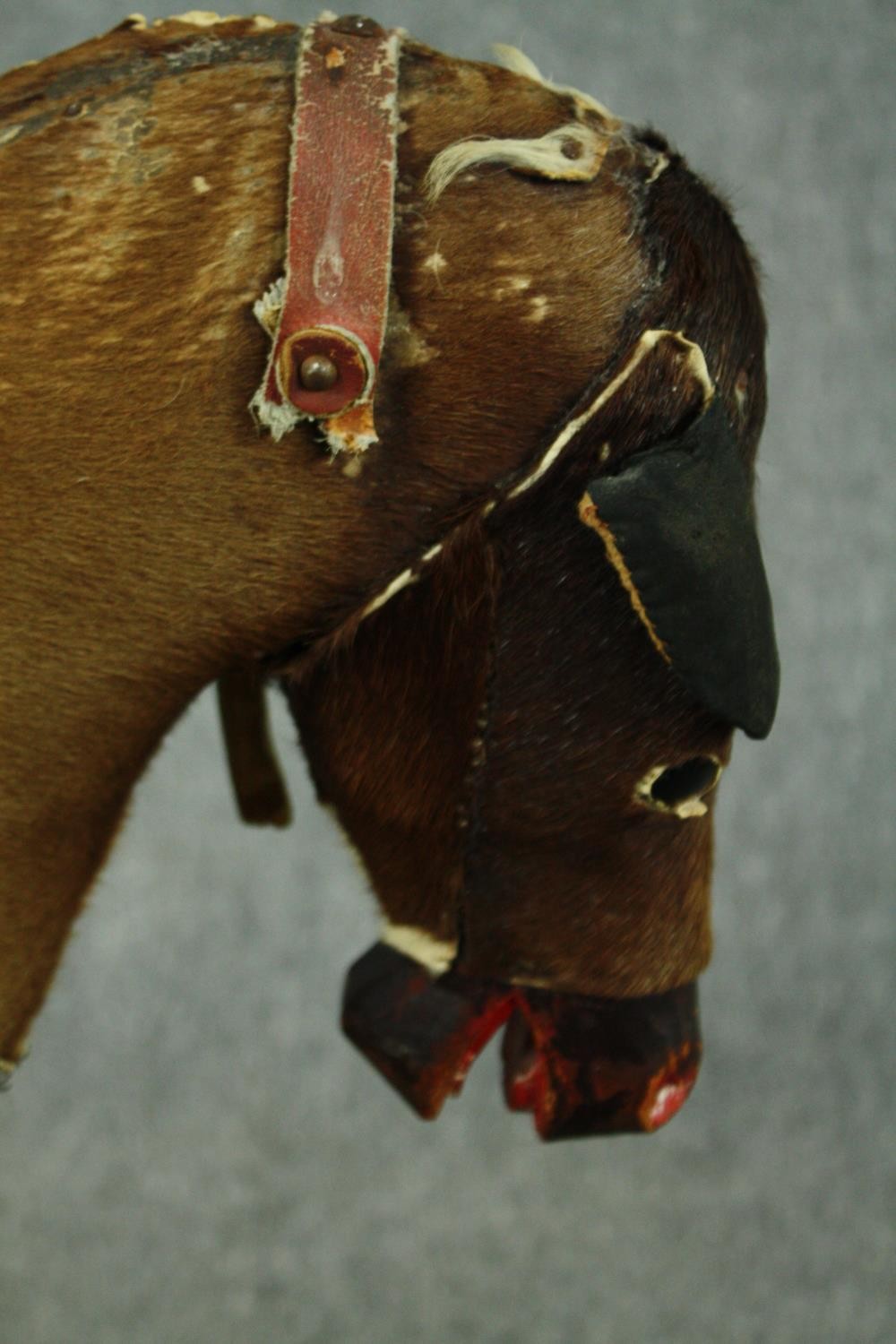 A vintage rocking horse in cowhide covering. H.74 W.110 D.38cm. - Image 7 of 14