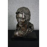 A bronze bust of a male head signed Roscini. H.46 W.36 D.20cm.