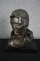 A bronze bust of a male head signed Roscini. H.46 W.36 D.20cm.