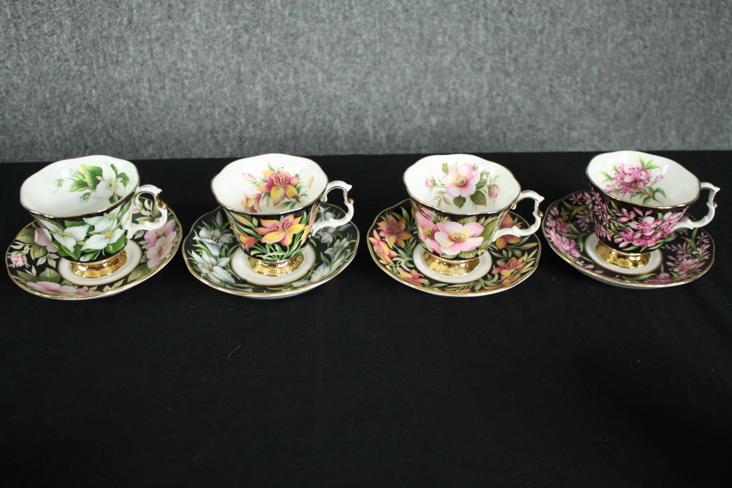 A collection of tea cups and saucers, including an orange and white early 20th century floral design - Image 17 of 19