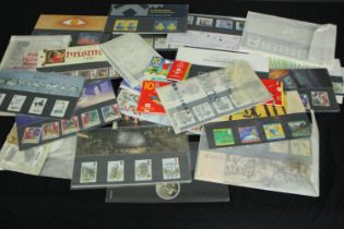 A collection of modern first issue British stamps dating from between the late 90s and early