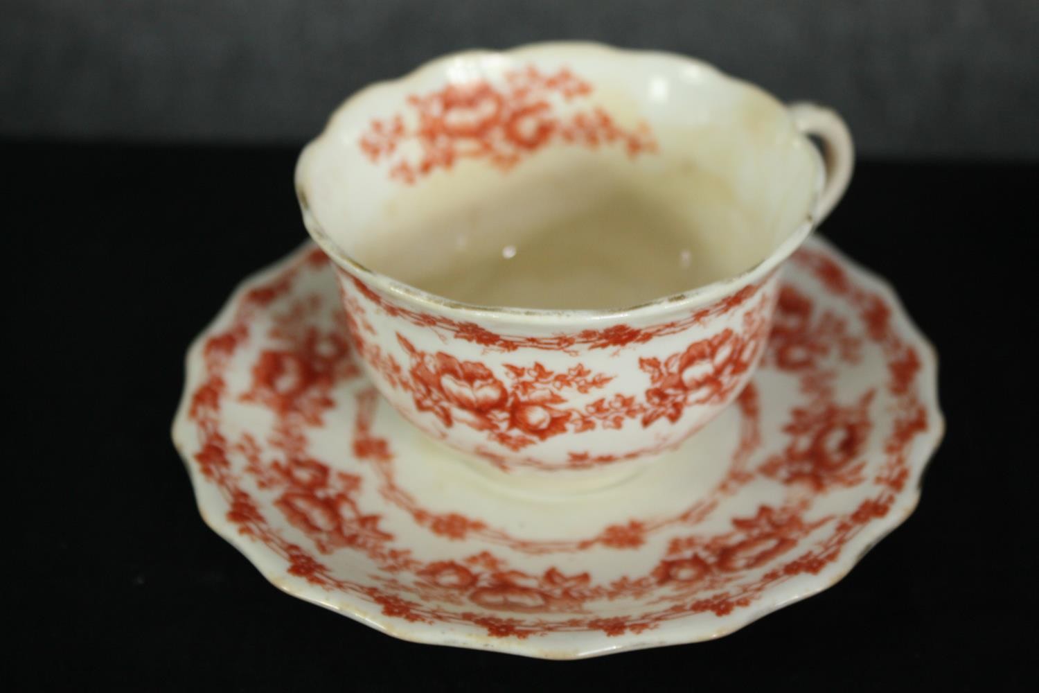 A collection of tea cups and saucers, including an orange and white early 20th century floral design - Image 13 of 19