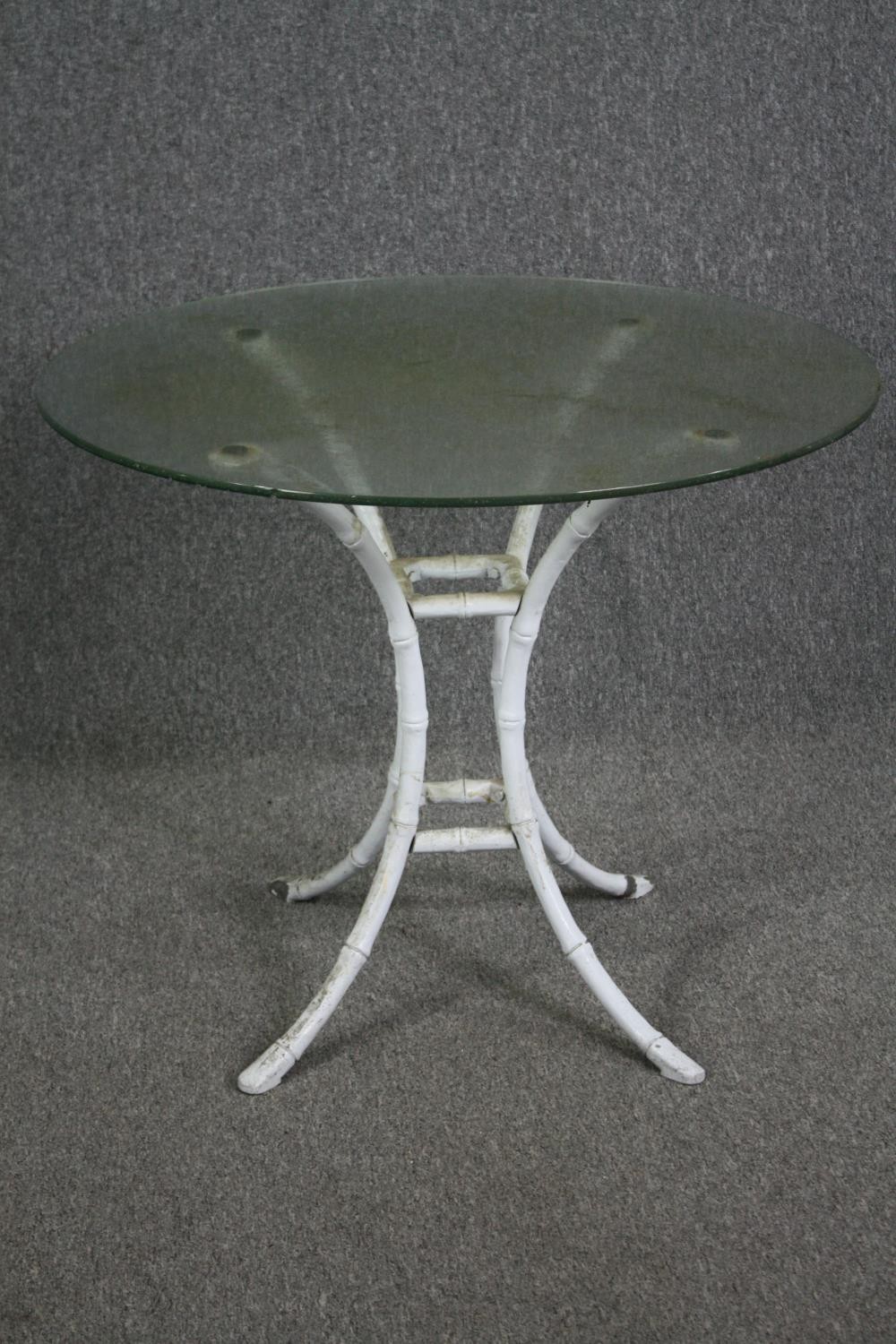 Garden or conservatory table, plate glass on faux bamboo painted metal base. H.74 Dia.91cm.