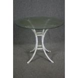 Garden or conservatory table, plate glass on faux bamboo painted metal base. H.74 Dia.91cm.