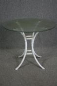 Garden or conservatory table, plate glass on faux bamboo painted metal base. H.74 Dia.91cm.