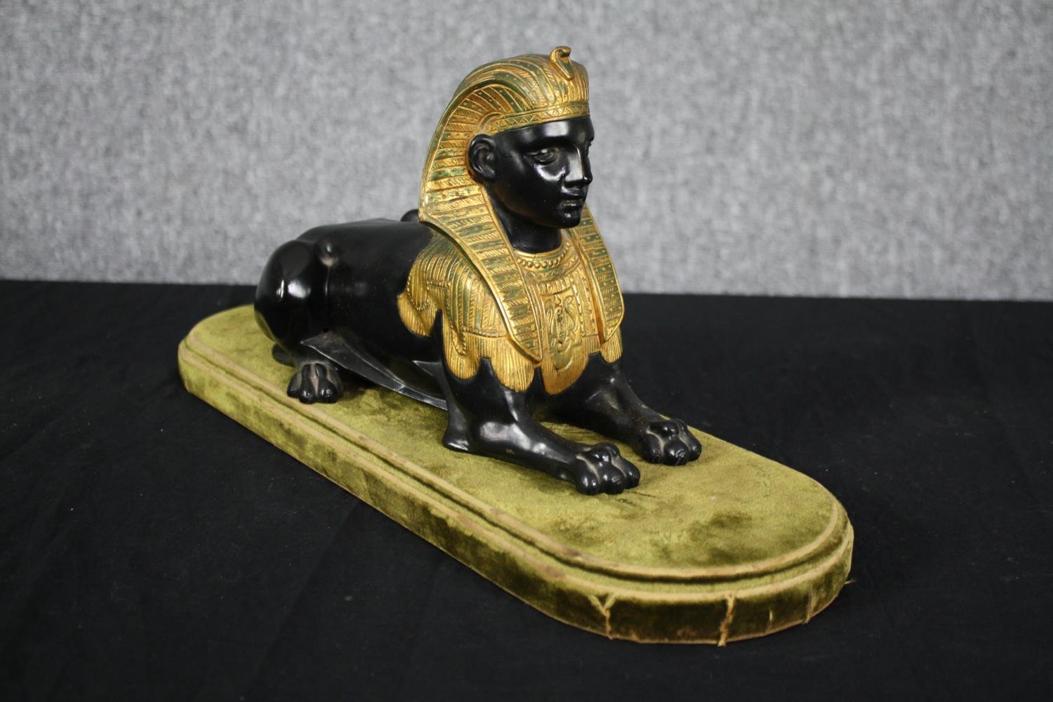 A Grand Tour Egyptian Revival spelter and gilt figure of a recumbent Sphinx. H.20 W.43 D.14cm. - Image 2 of 5