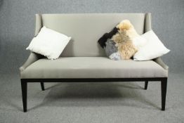 A contemporary upholstered bench settee. H.96 W.133 D.60cm.