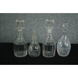 A collection of four early twentieth century cut glass decanters complete with their stoppers. One