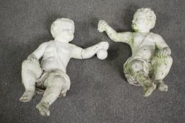 A pair of painted concrete garden cherubs. H.78cm. (Each).