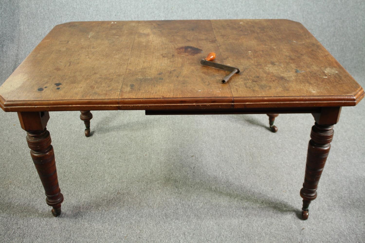 Dining table, Victorian walnut with fixed central leaf. H.74 W.148 D.104cm.