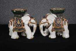 A pair of miniature glazed Eastern elephant stands. H.28cm. (Each).