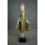 A floor standing Cambodian buddha statue, carved gilded and painted and inset with mirrored mosaic
