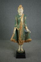 A floor standing Cambodian buddha statue, carved gilded and painted and inset with mirrored mosaic