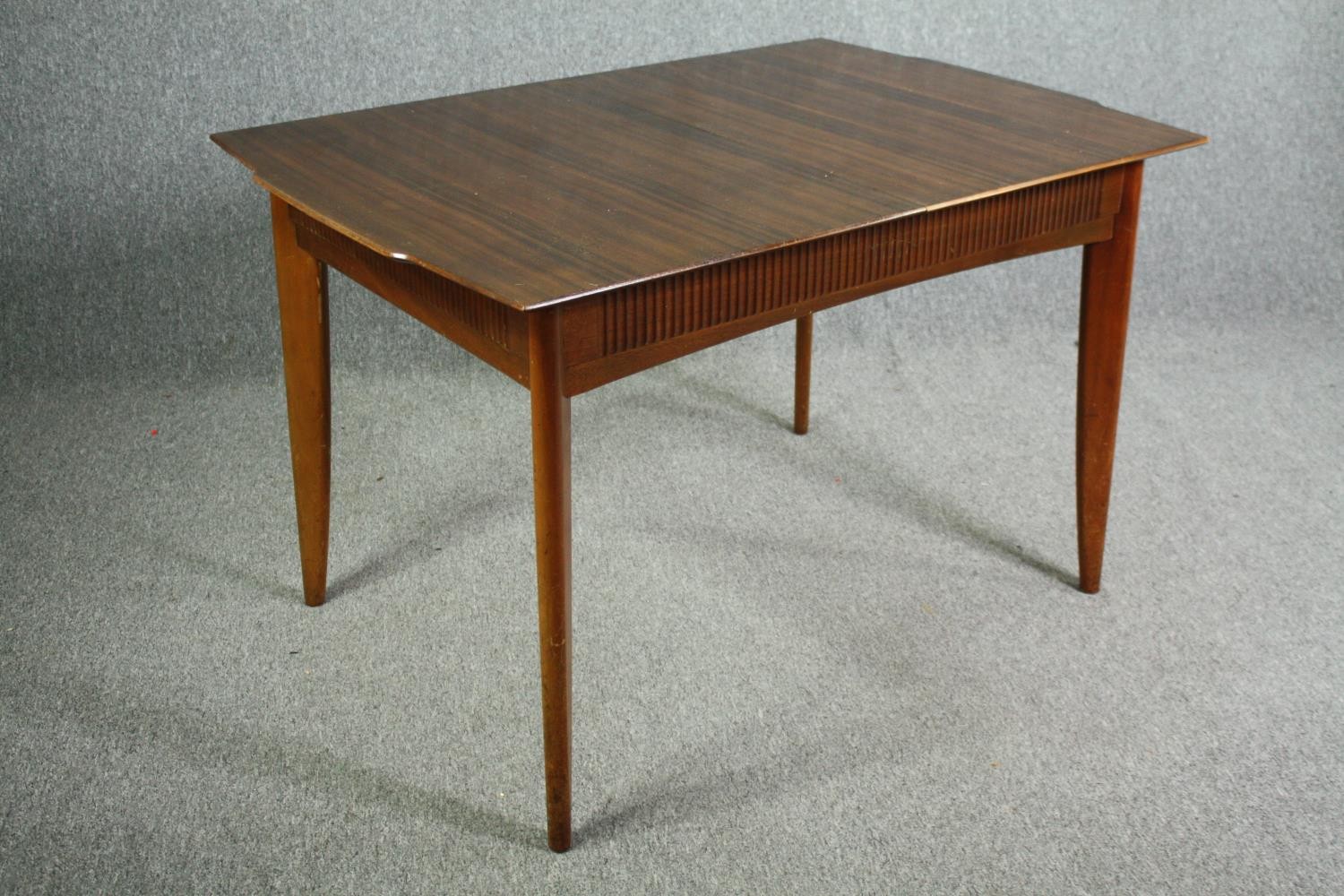 A mid century Waring and Gillow Ltd dining table. H.75 W.122 D.84cm. (The central leaf is missing - Image 2 of 7