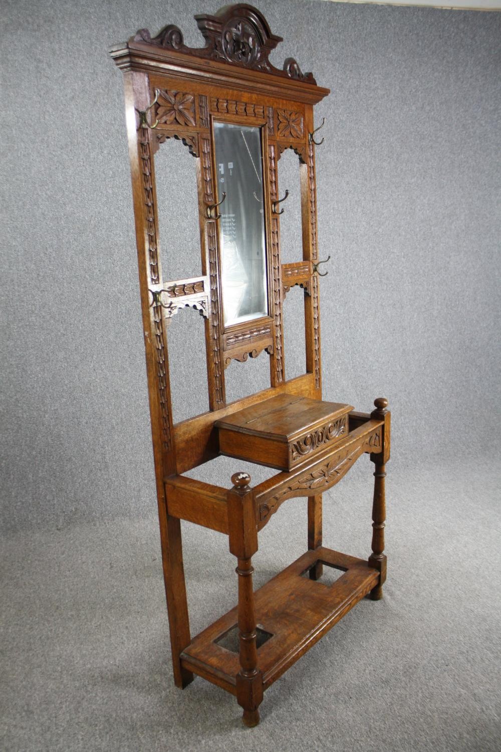 A Victorian period oak hall hat /coat and cane stand, dating from around 1890. With a shaped cornice - Image 4 of 6