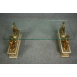 Coffee table, with plate glass top supported by twin gilt winged sphinxes on painted pedestals. H.42