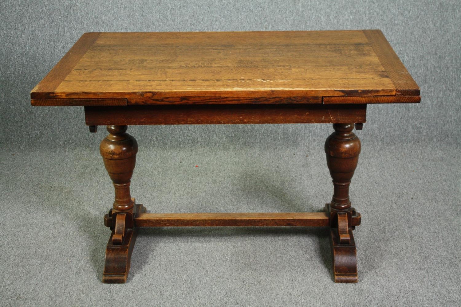 Dining table, mid century oak Jacobean style with draw leaf action. H.76 W.183 (ext) D.83cm.