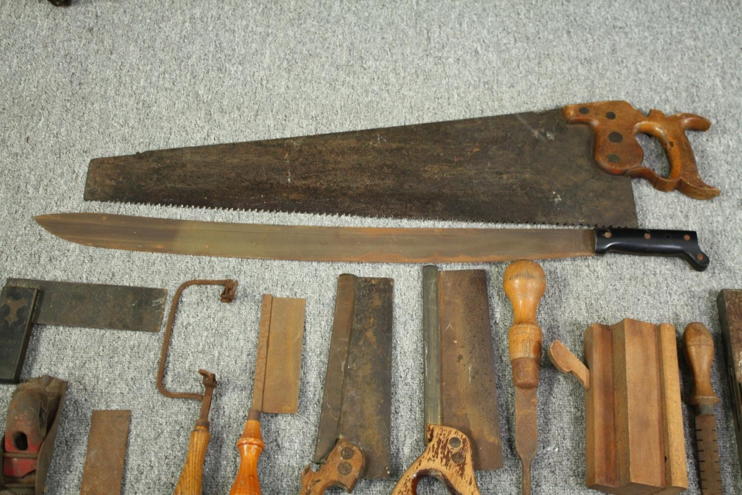 A large mid twentieth century machete and an assortment of wood working tools. The manchette with - Image 3 of 7