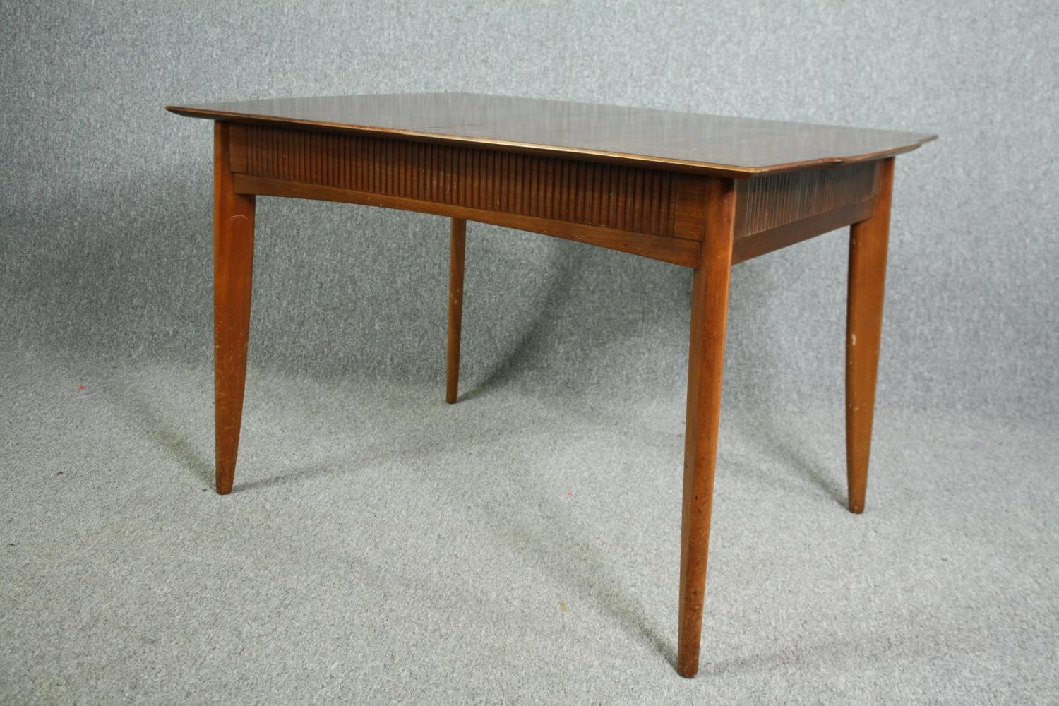 A mid century Waring and Gillow Ltd dining table. H.75 W.122 D.84cm. (The central leaf is missing - Image 4 of 7
