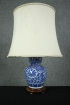 A vintage style table lamp with Chinese blue and white decoration. H.66cm.