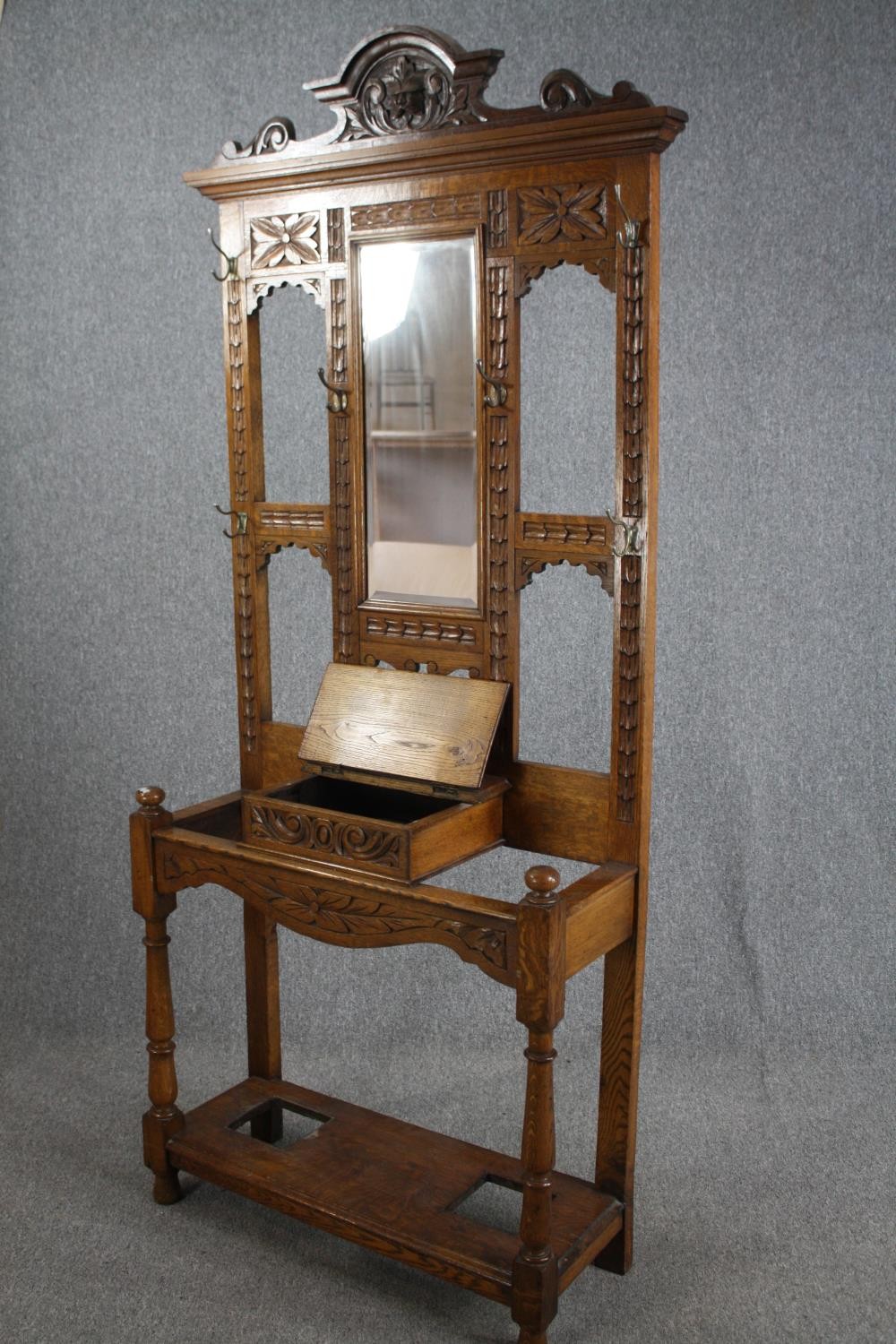 A Victorian period oak hall hat /coat and cane stand, dating from around 1890. With a shaped cornice - Image 3 of 6
