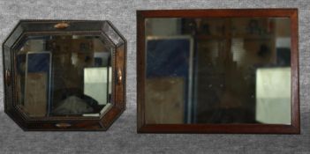 A mid century oak framed mirror and another similar mirror. H.49 W.58cm.