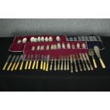 An extensive collection of mixed silver plate and bone handled cutlery. 30cm. (Largest)